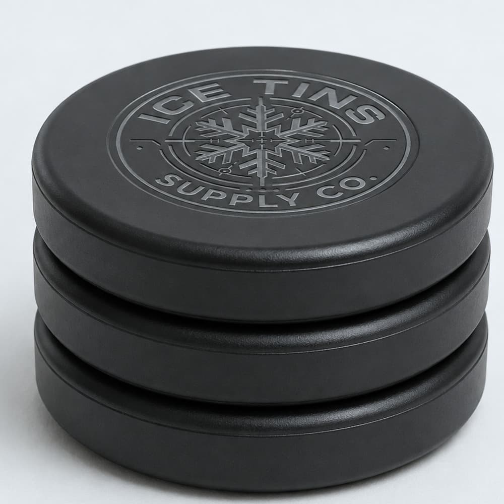 Three Chillcore ice packs stacked, matte black with the engraved emblem